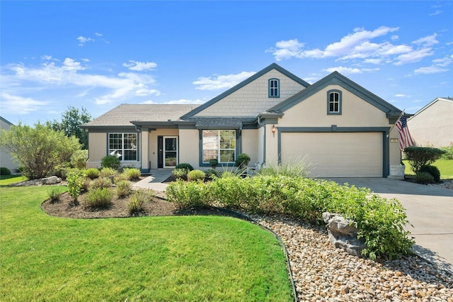 view of front of home with a garage and a front lawn