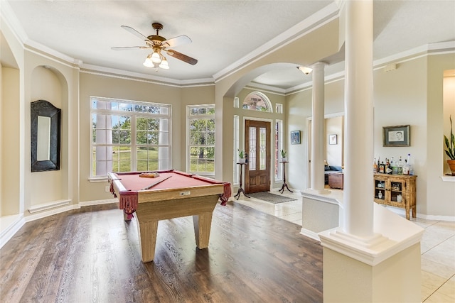 rec room with hardwood / wood-style flooring, bar area, decorative columns, billiards, and ceiling fan