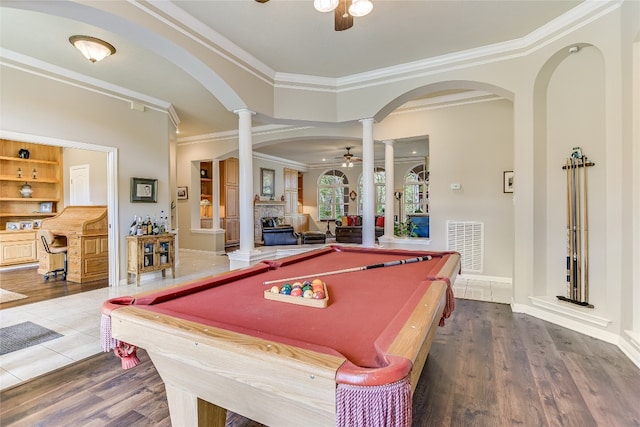 rec room featuring hardwood / wood-style flooring, ceiling fan, ornamental molding, pool table, and decorative columns