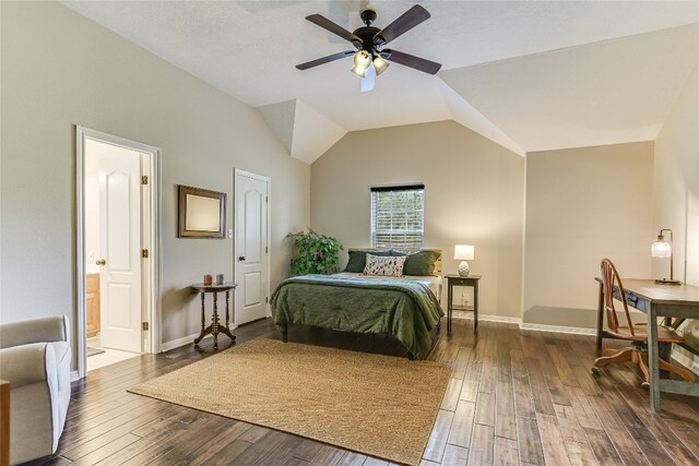 bedroom featuring lofted ceiling, dark wood-type flooring, ceiling fan, and ensuite bath