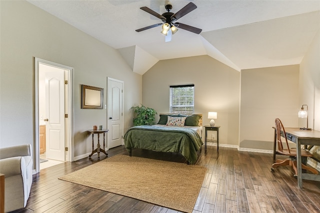 bedroom featuring ceiling fan, vaulted ceiling, dark hardwood / wood-style floors, and connected bathroom