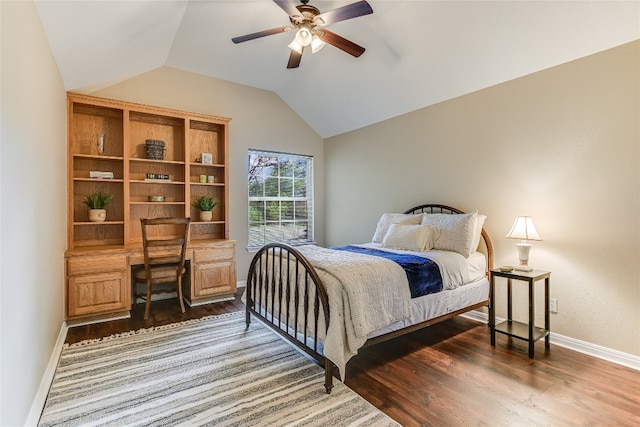 bedroom with ceiling fan, lofted ceiling, and dark hardwood / wood-style floors