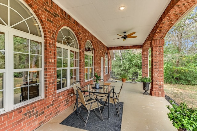 view of patio featuring ceiling fan and covered porch