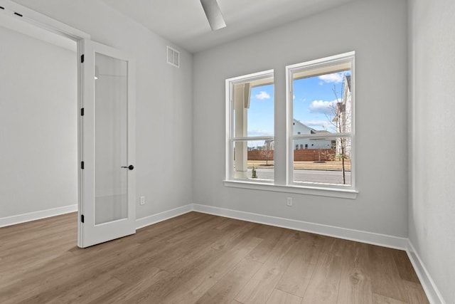 6512 Cowman Way, Austin, TX 78747 - unfurnished room with wood finished floors and baseboards