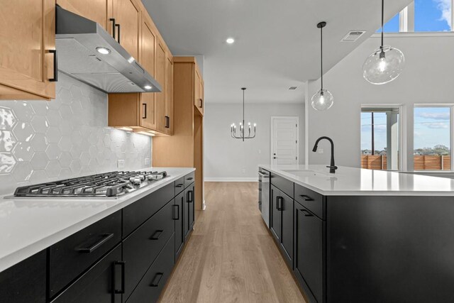 6512 Cowman Way, Austin, TX 78747 - kitchen featuring extractor fan, stainless steel gas cooktop, plenty of natural light, tasteful backsplash, and recessed lighting