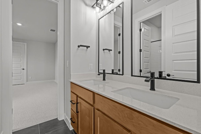 6512 Cowman Way, Austin, TX 78747 - bathroom with double vanity and tile patterned flooring