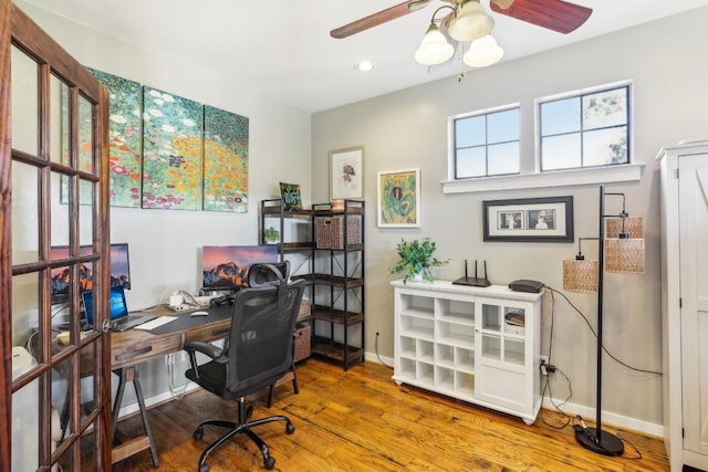 office area with hardwood / wood-style floors and ceiling fan