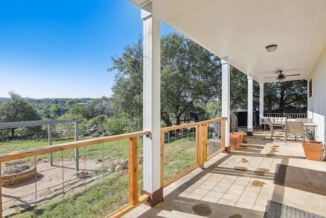 exterior space with ceiling fan