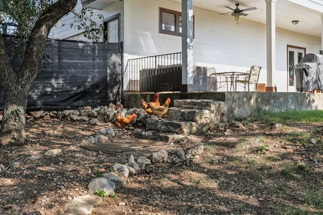 view of yard with ceiling fan