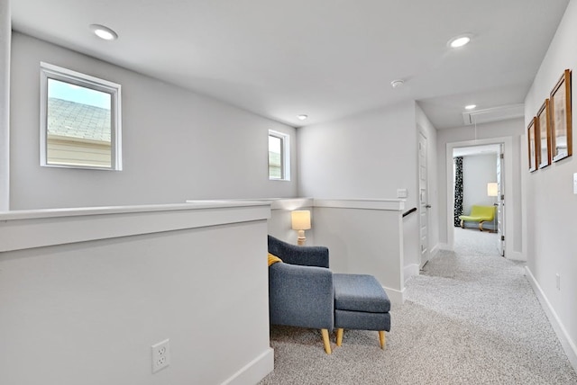 living area with light colored carpet