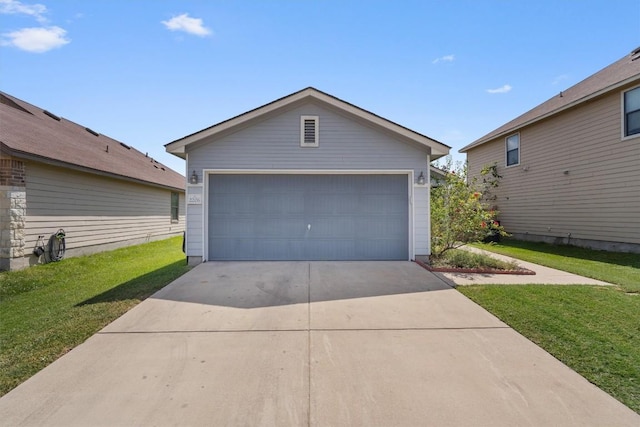 garage featuring a yard