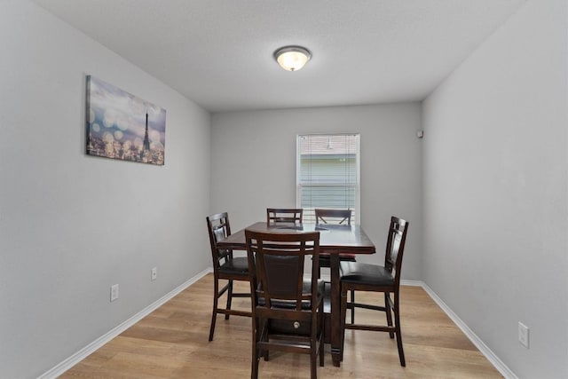 dining area with light hardwood / wood-style floors