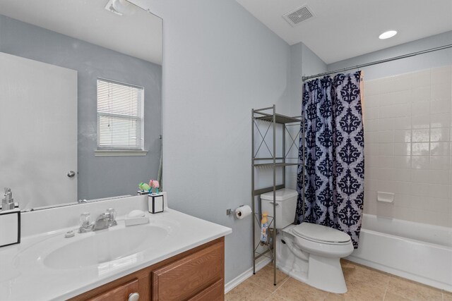 full bathroom featuring vanity, shower / tub combo, tile patterned floors, and toilet