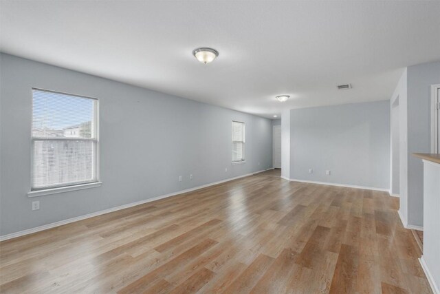 unfurnished room with light hardwood / wood-style flooring