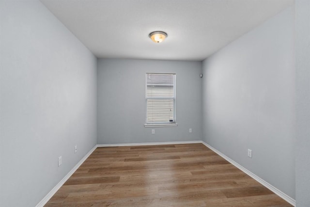 spare room featuring light hardwood / wood-style floors