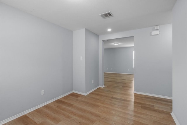 unfurnished room with light hardwood / wood-style flooring