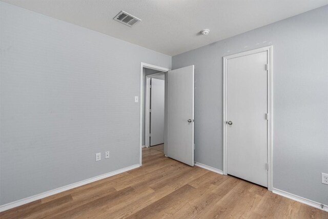 unfurnished bedroom featuring light hardwood / wood-style floors