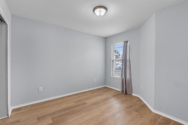 unfurnished room with light hardwood / wood-style flooring