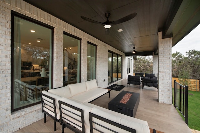 view of patio featuring ceiling fan and outdoor lounge area