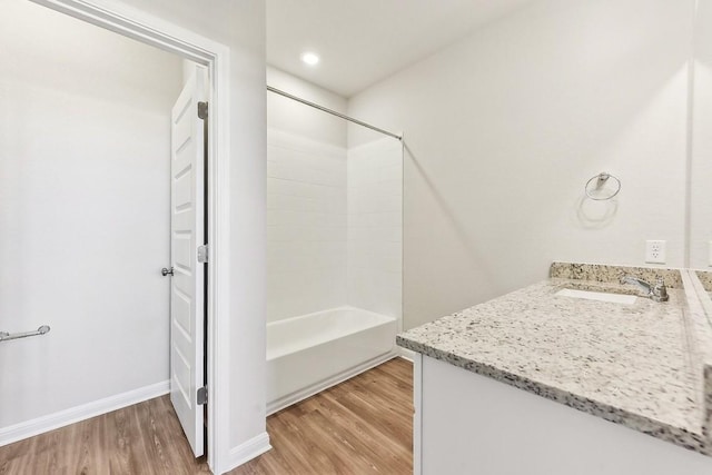 239 Spirit St, Elgin, TX 78621 - full bath with wood finished floors, vanity, bathtub / shower combination, and baseboards