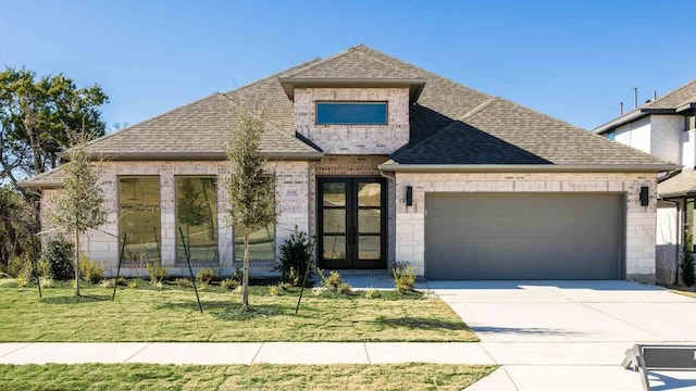 view of front facade featuring a front yard and french doors