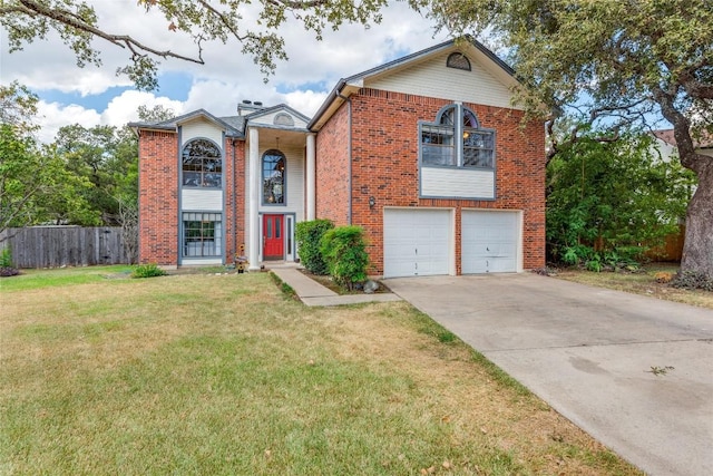 view of front of house featuring a front yard and a garage