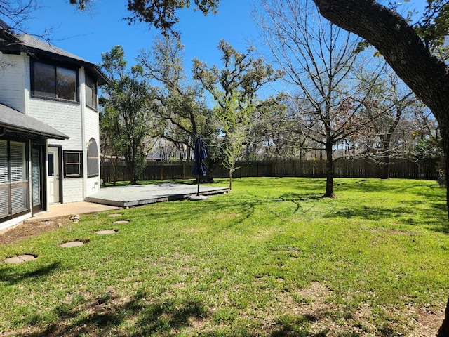 view of yard featuring a patio and a fenced backyard