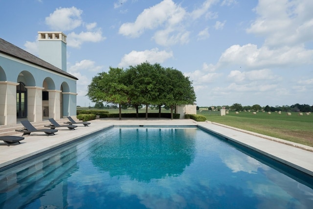 view of swimming pool featuring a patio area