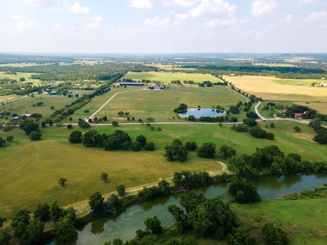 bird's eye view with a water view and a rural view