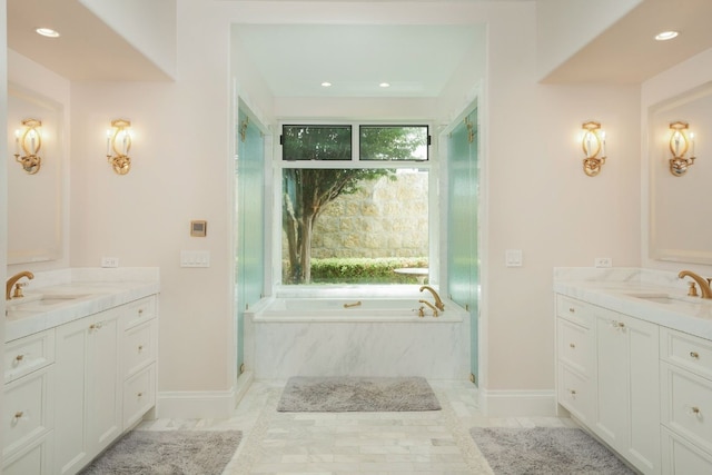 bathroom with tile patterned flooring, independent shower and bath, and vanity