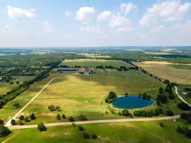 aerial view with a water view and a rural view