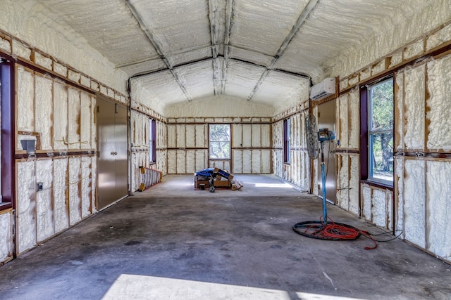 garage featuring a wall unit AC