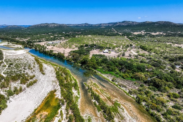 bird's eye view with a water and mountain view