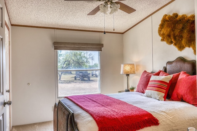 carpeted bedroom featuring a textured ceiling, ornamental molding, vaulted ceiling, and ceiling fan