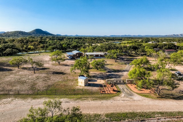 birds eye view of property with a mountain view and a rural view