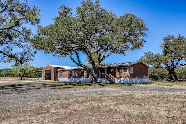 view of front of home with an outdoor structure and a garage