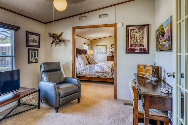 carpeted bedroom with a textured ceiling, crown molding, and vaulted ceiling