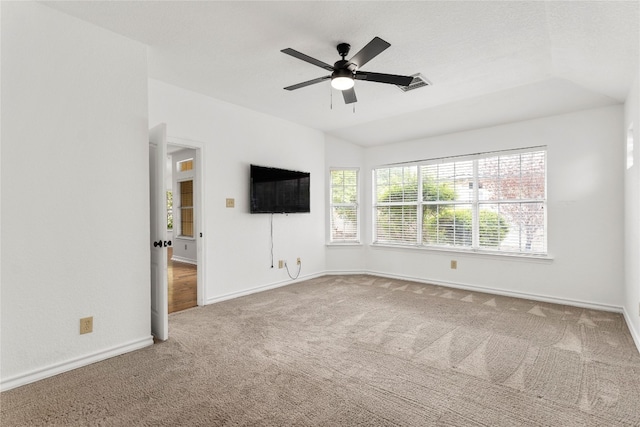 unfurnished living room featuring carpet, lofted ceiling, and ceiling fan