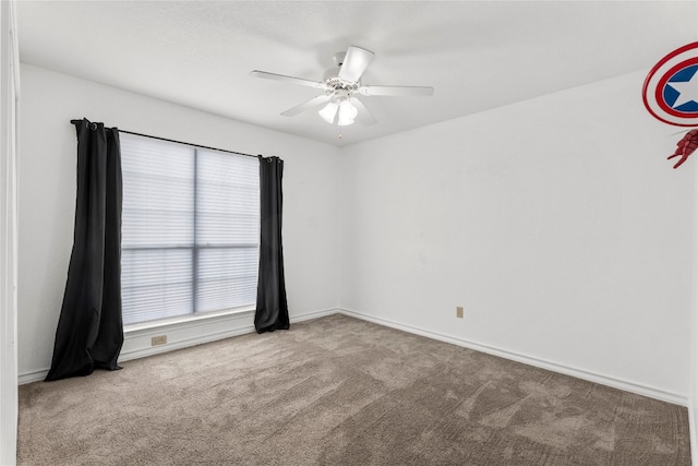 unfurnished room featuring carpet and ceiling fan