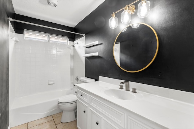 full bathroom with vanity, tiled shower / bath, tile patterned floors, and toilet