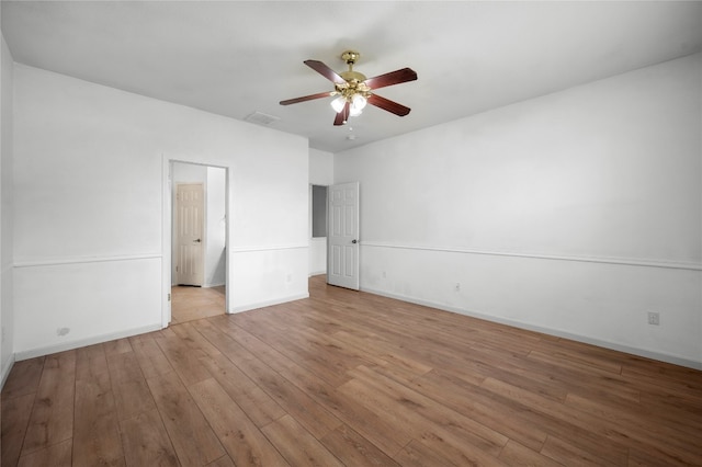 spare room featuring ceiling fan and light hardwood / wood-style flooring