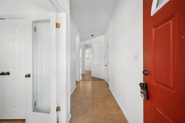 hallway with light tile patterned floors