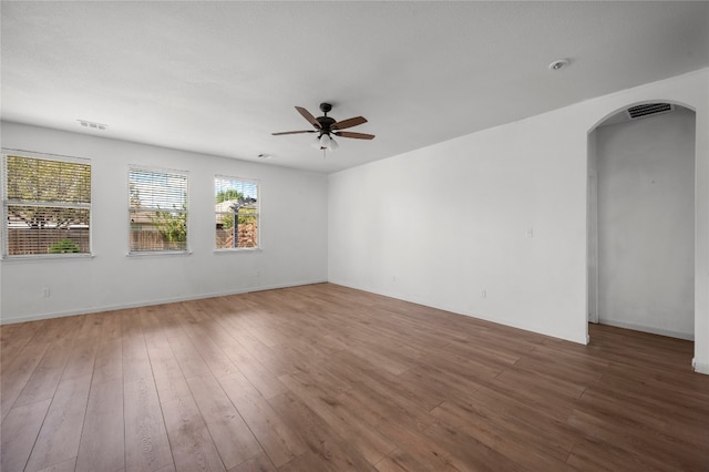 spare room featuring ceiling fan and hardwood / wood-style flooring