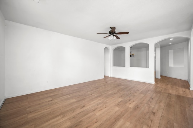 unfurnished living room with light hardwood / wood-style floors and ceiling fan