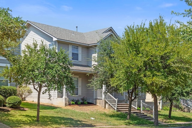 view of front of home with a front lawn and a porch