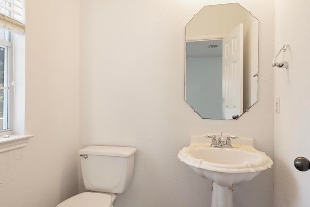 bathroom featuring toilet