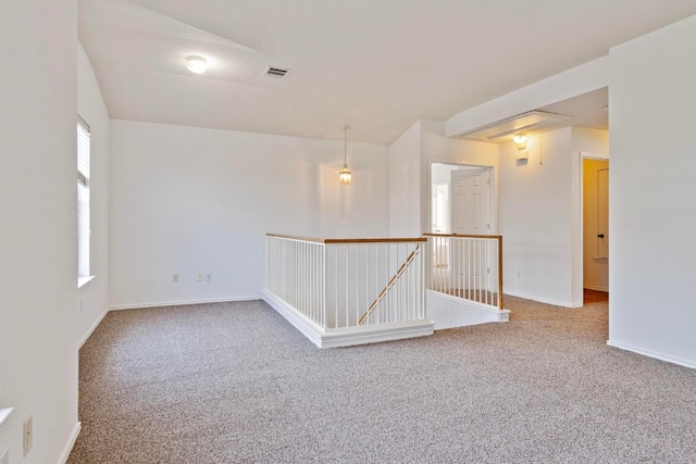 unfurnished room with carpet floors