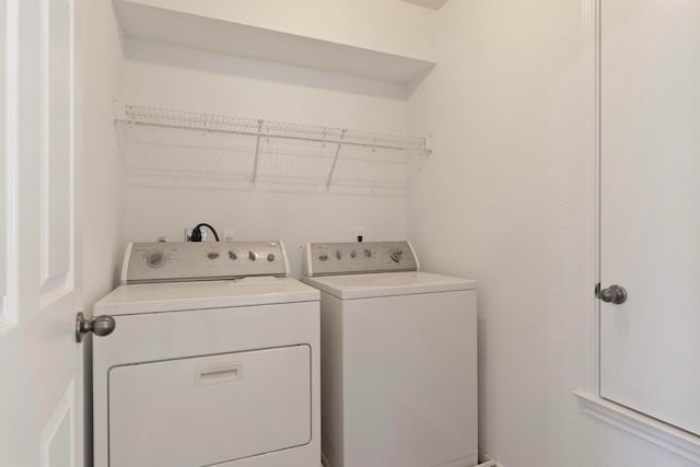 washroom featuring washing machine and dryer