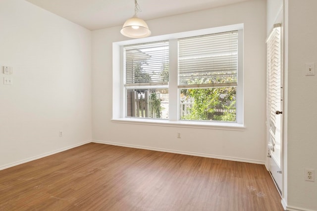 spare room with hardwood / wood-style flooring