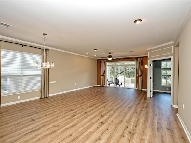 unfurnished living room with crown molding, ceiling fan with notable chandelier, and light hardwood / wood-style floors